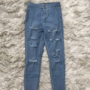 High waisted light wash denim jeans. Joni fit